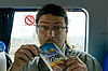 Tour Guide Amir Drinking Yotvata Choco (Chocolate Milk in a Bag)